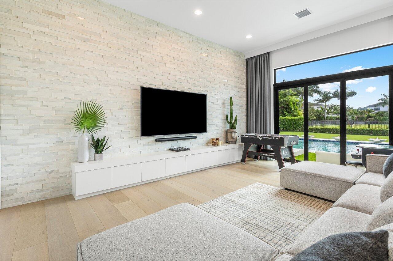 9276 Biaggio Road Boca Raton, FL 33496 - Photo 25 of 70 a living room with furniture and a flat screen tv