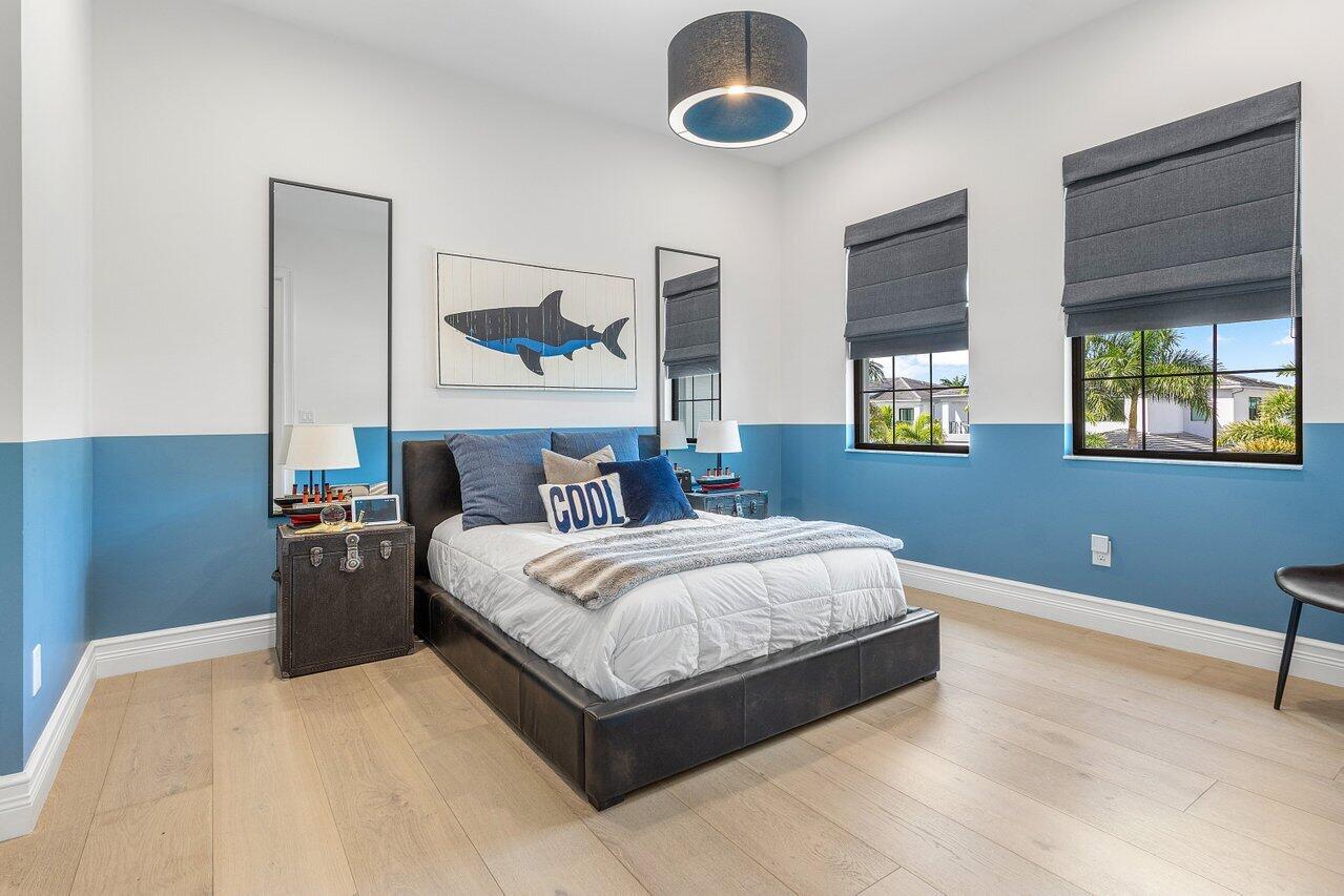 9276 Biaggio Road Boca Raton, FL 33496 - Photo 35 of 70 a bedroom with a bed and painting on the wall