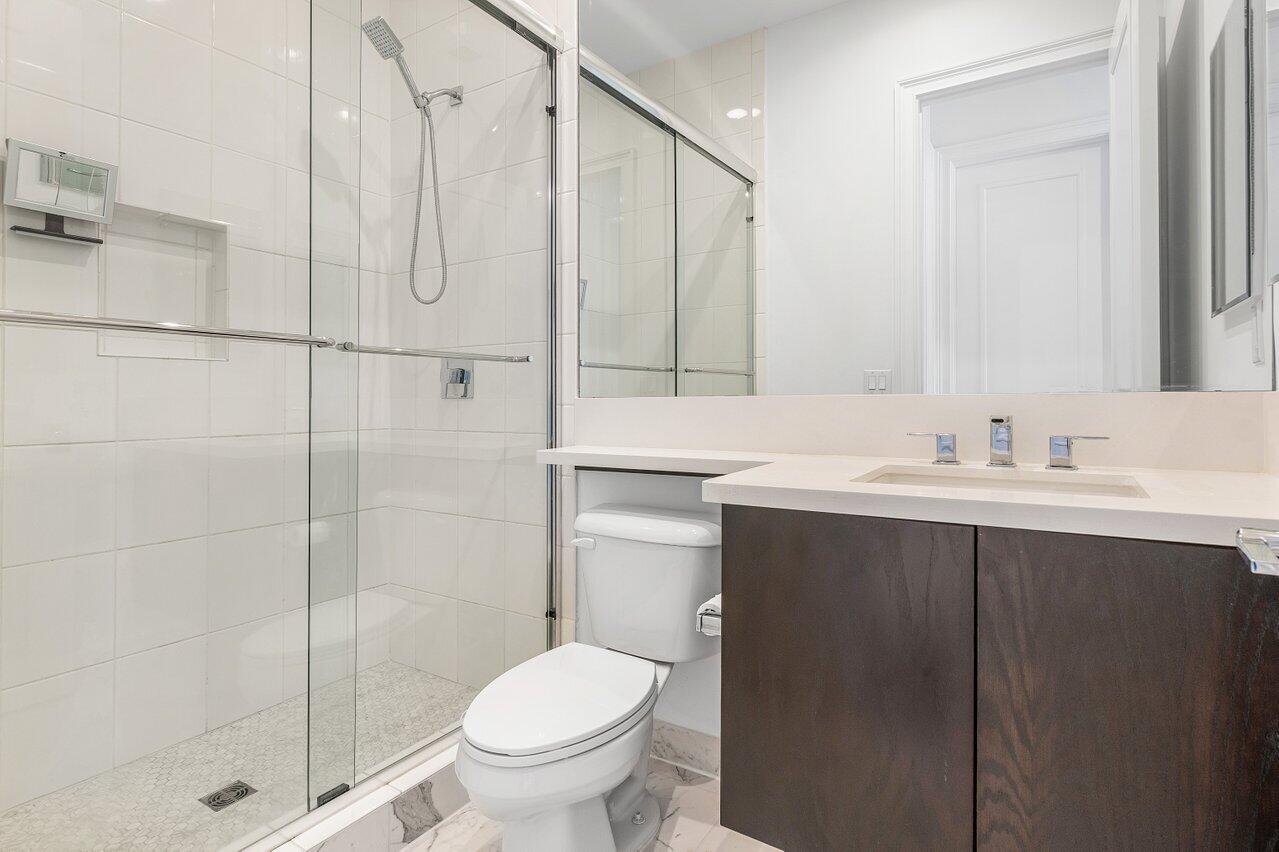 9276 Biaggio Road Boca Raton, FL 33496 - Photo 36 of 70 a bathroom with a sink toilet and shower