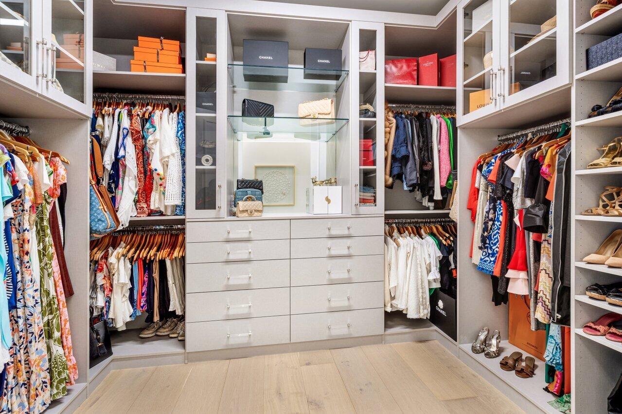 9276 Biaggio Road Boca Raton, FL 33496 - Photo 45 of 70 a view of walk in closet with clothes and shoes