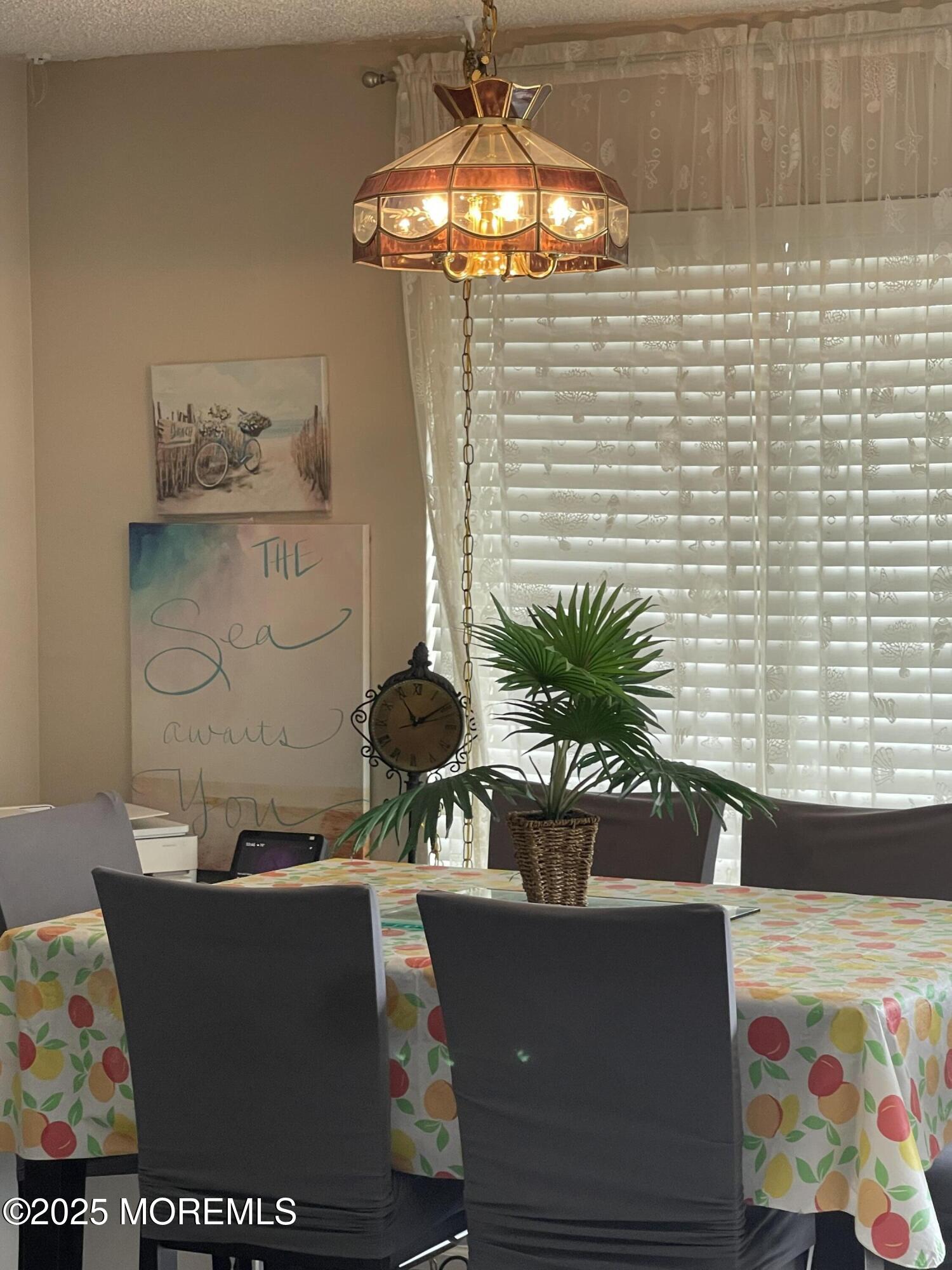 202 Carteret Avenue, Unit A2 Seaside Heights, NJ 08751 - Photo 6 of 15 a potted plant sitting on top of a wooden floor