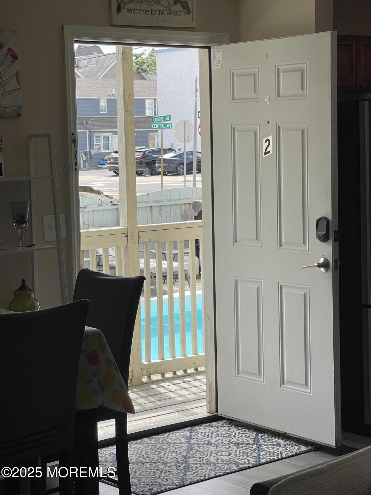 202 Carteret Avenue, Unit A2 Seaside Heights, NJ 08751 - Photo 7 of 15 a living room with furniture and a window