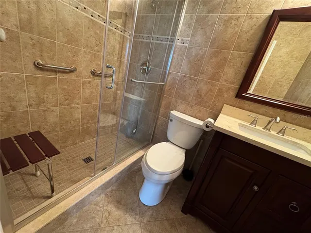 a bathroom with a toilet and shower