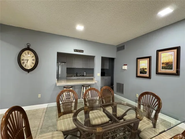 a view of a dining room with furniture and window