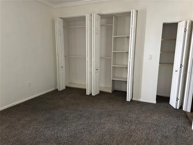 a view of empty room with closet area