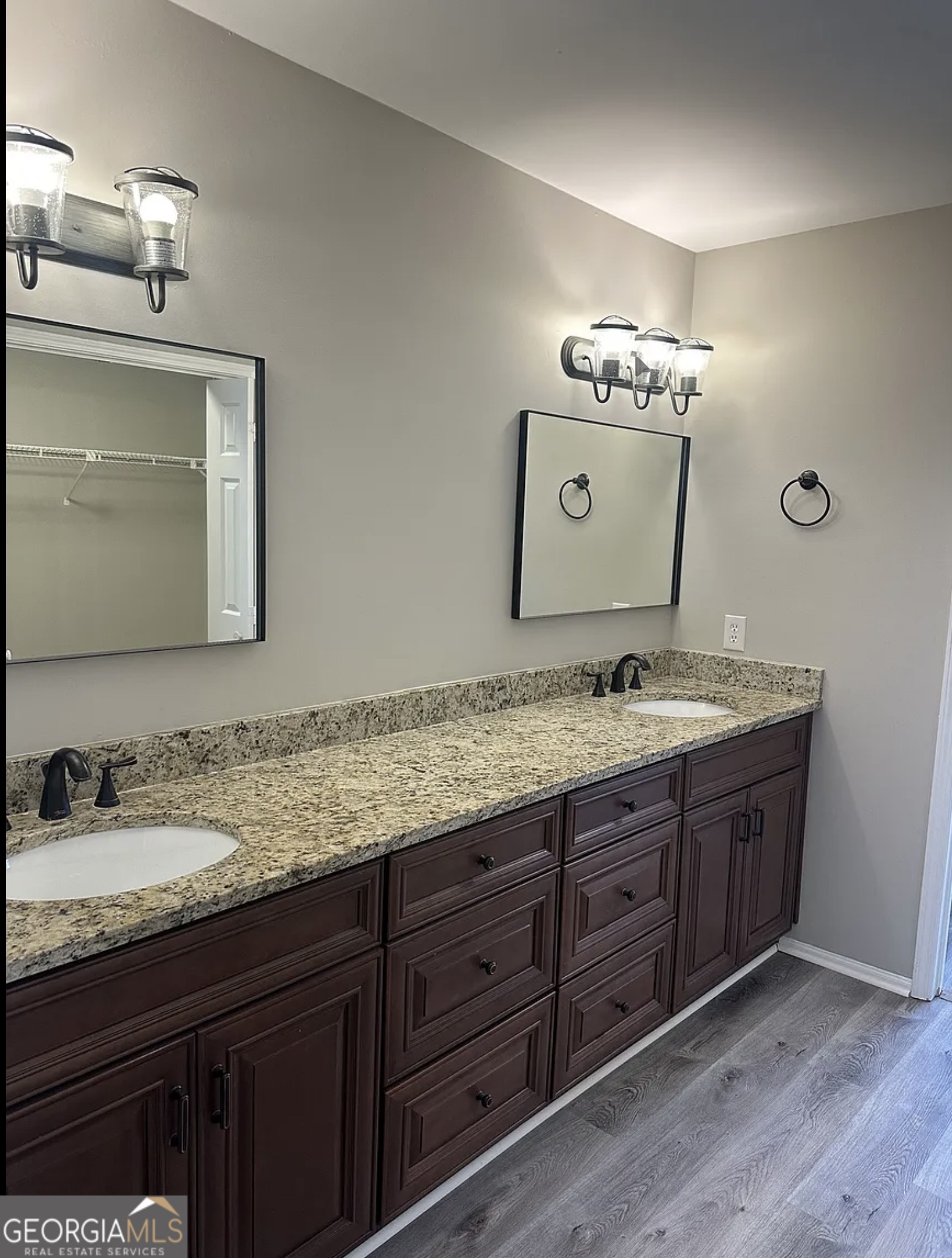 3 South Riversong Lane Alpharetta, GA 30022 - Photo 5 of 7 a bathroom with a granite countertop sink vanity and mirror