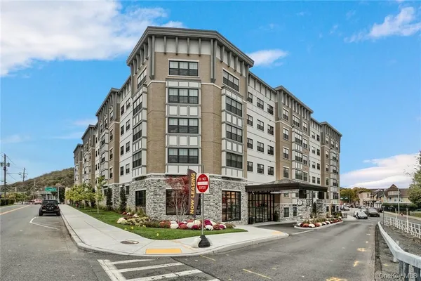 a front view of a building with street view
