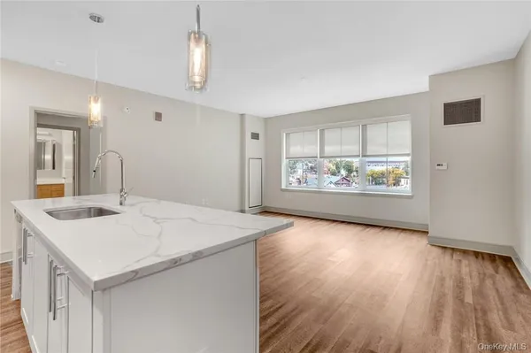 a view of kitchen island with wooden floor