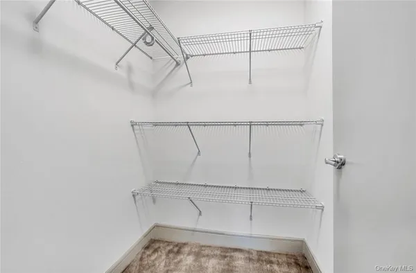 a view of a room with racks on the wall