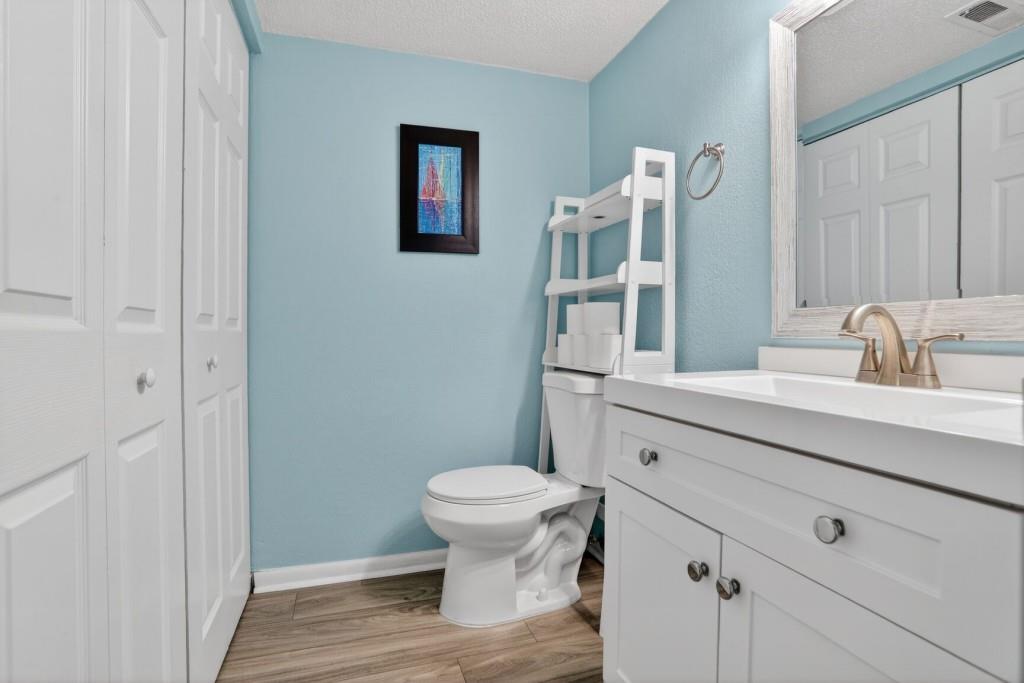 6900 Roswell Road, Unit L7 Atlanta, GA 30328 - Photo 13 of 25 a bathroom with a toilet sink and mirror