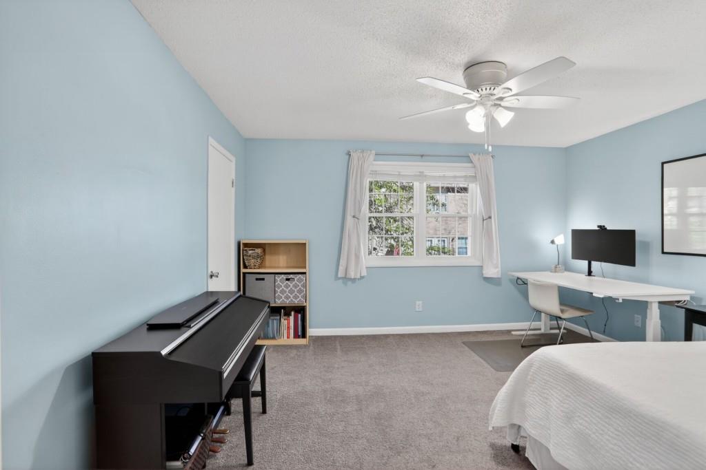 6900 Roswell Road, Unit L7 Atlanta, GA 30328 - Photo 16 of 25 a bedroom with a bed and a window