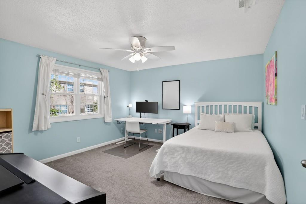 6900 Roswell Road, Unit L7 Atlanta, GA 30328 - Photo 17 of 25 a spacious bedroom with a bed and a window
