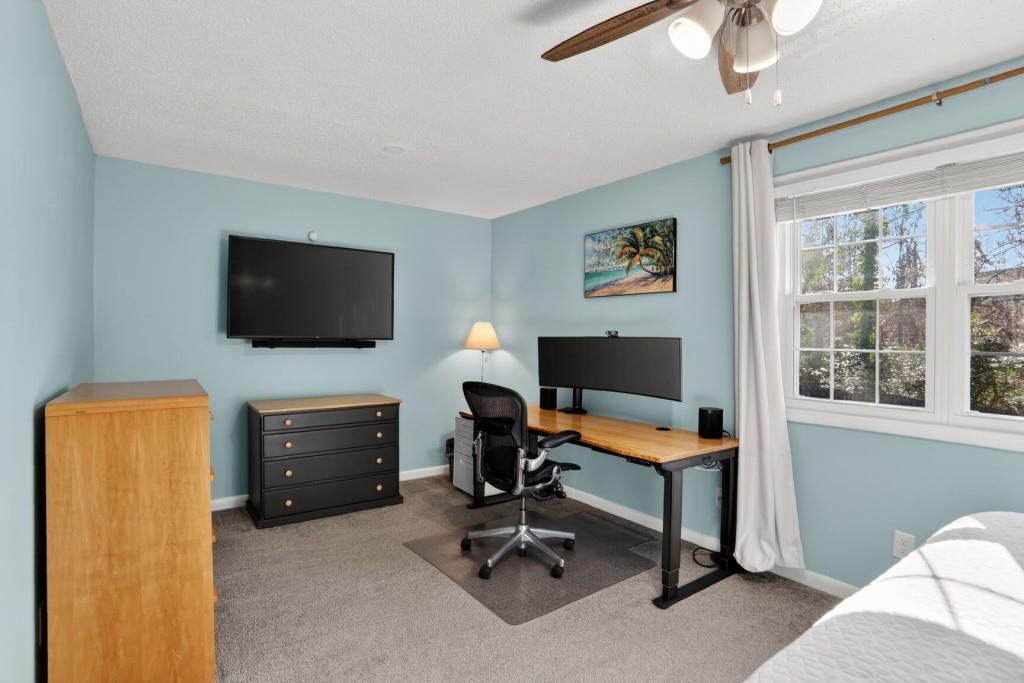 6900 Roswell Road, Unit L7 Atlanta, GA 30328 - Photo 22 of 25 a view of a livingroom with workspace and a window