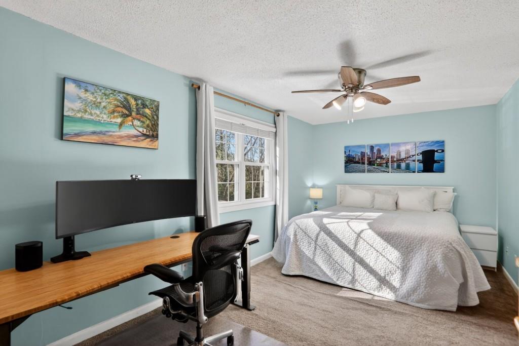 6900 Roswell Road, Unit L7 Atlanta, GA 30328 - Photo 23 of 25 a bedroom with a bed and a desk