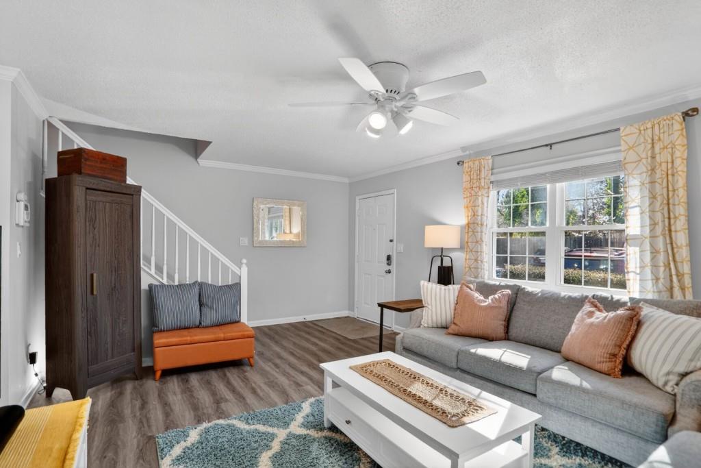 6900 Roswell Road, Unit L7 Atlanta, GA 30328 - Photo 5 of 25 a living room with furniture and a window