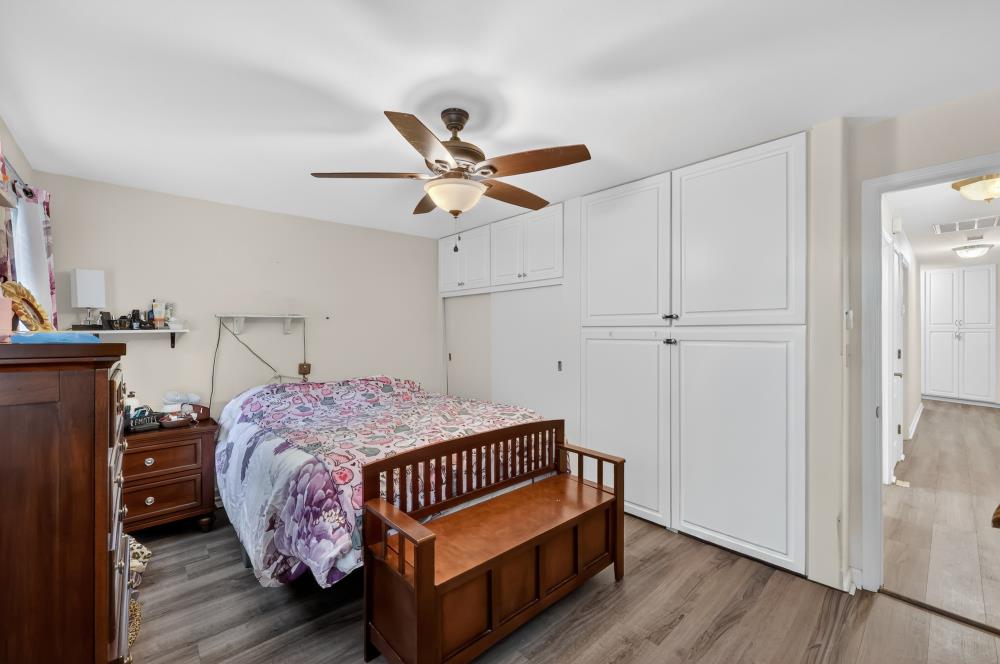 2026 Lily Valley Way West Point, CA 95255 - Photo 27 of 39 a bedroom with a bed and wooden floor