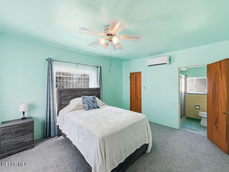 4135 Emory Road El Paso, TX 79922 - Photo 55 of 73 a bedroom with a large bed and a chandelier fan