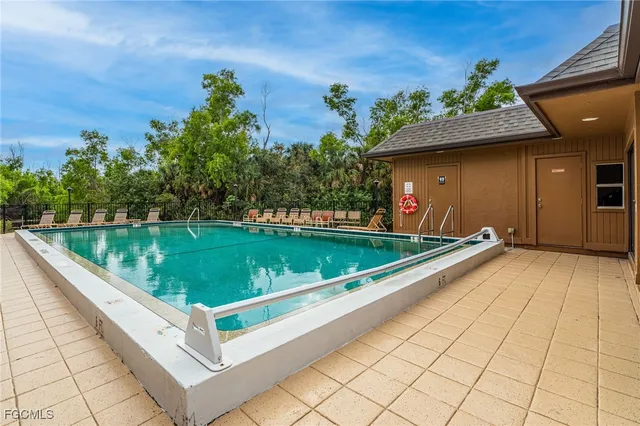 a view of a mini pool and a table in a balcony