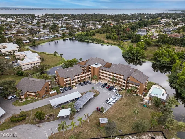 an aerial view of a house with a lake view