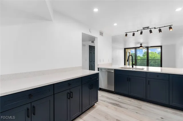 a spacious bathroom with a double vanity sink and a large mirror