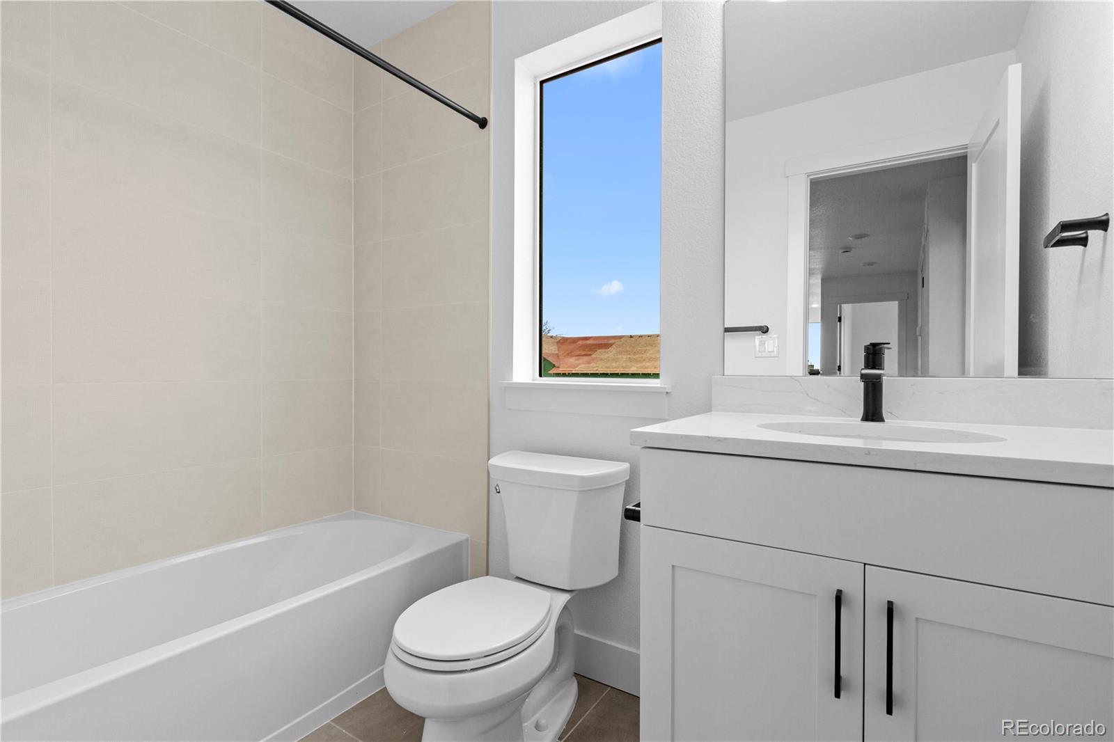 14281 Currant Street Broomfield, CO 80020 - Photo 22 of 23 a bathroom with a sink toilet and shower