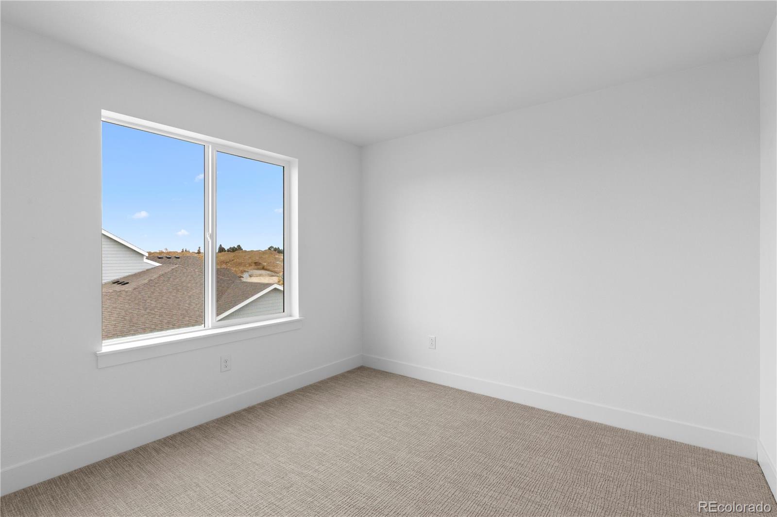 14281 Currant Street Broomfield, CO 80020 - Photo 23 of 23 an empty room with a window
