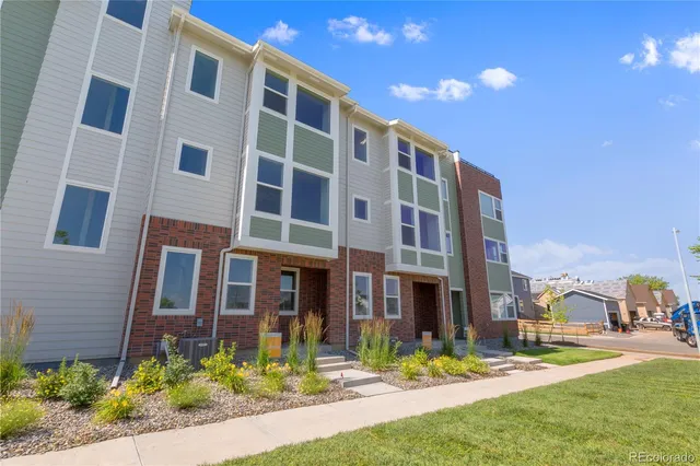 a view of a building with a yard