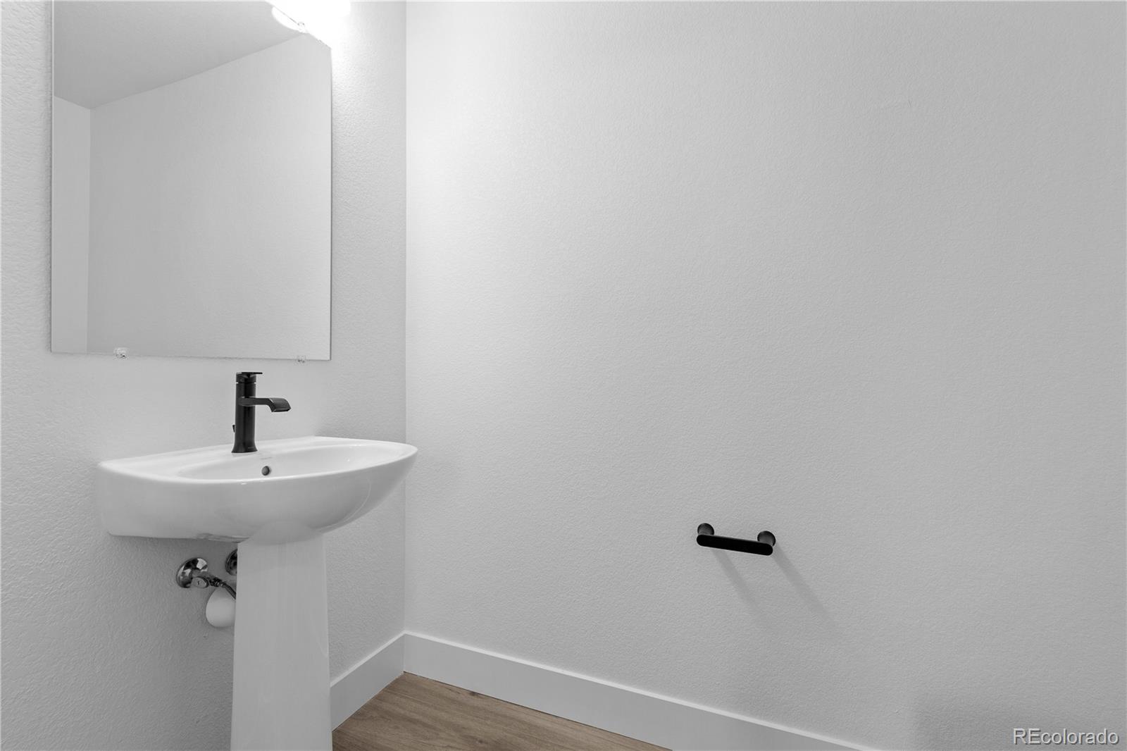 14281 Currant Street Broomfield, CO 80020 - Photo 9 of 23 a bathroom with a sink and mirror