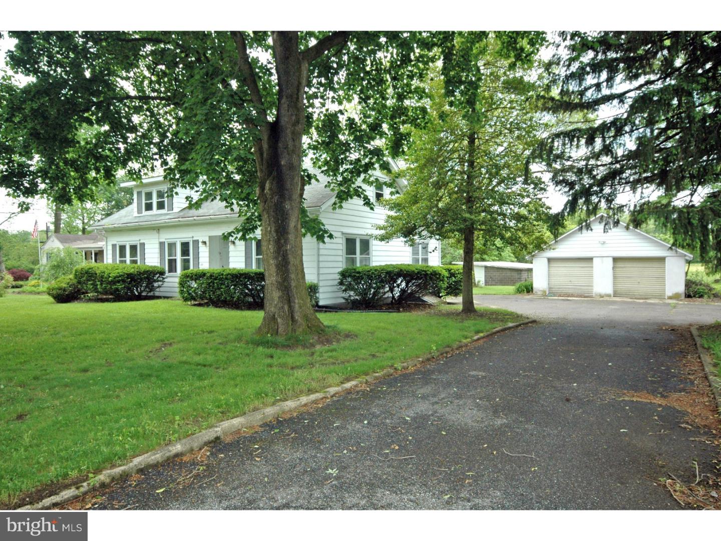 a view of house with outdoor space and garden