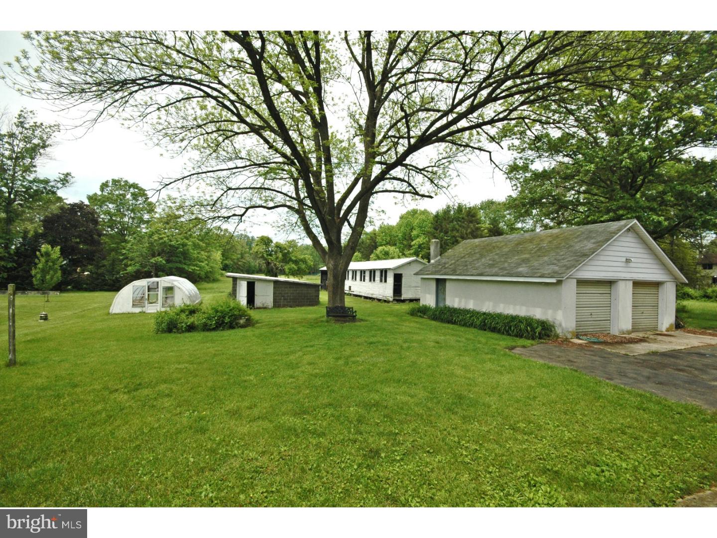 4211 Bridgeboro Road Moorestown, NJ 08057 - Photo 8 of 25 a front view of a house with a garden