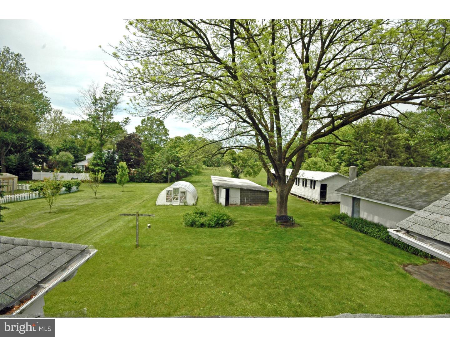 4211 Bridgeboro Road Moorestown, NJ 08057 - Photo 9 of 25 a backyard of a house with table and chairs