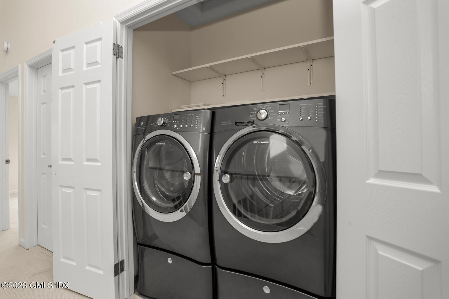 500 River Road, Unit 5 Cos Cob, CT 06807 - Photo 17 of 30 a utility room with dryer and washer
