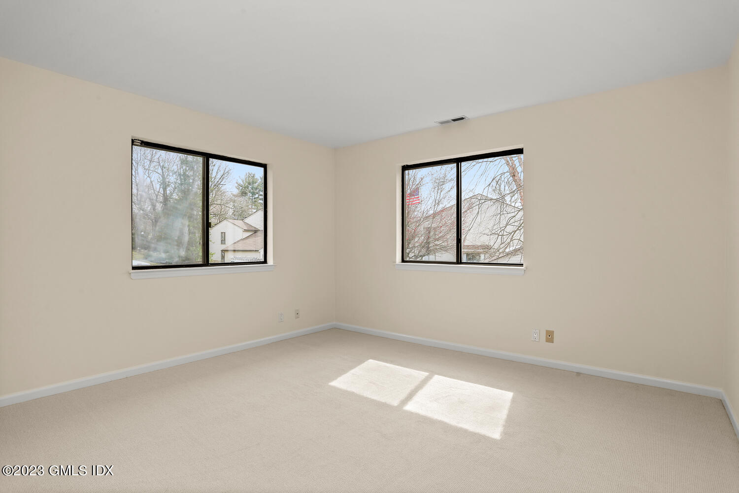500 River Road, Unit 5 Cos Cob, CT 06807 - Photo 19 of 30 an empty room with windows