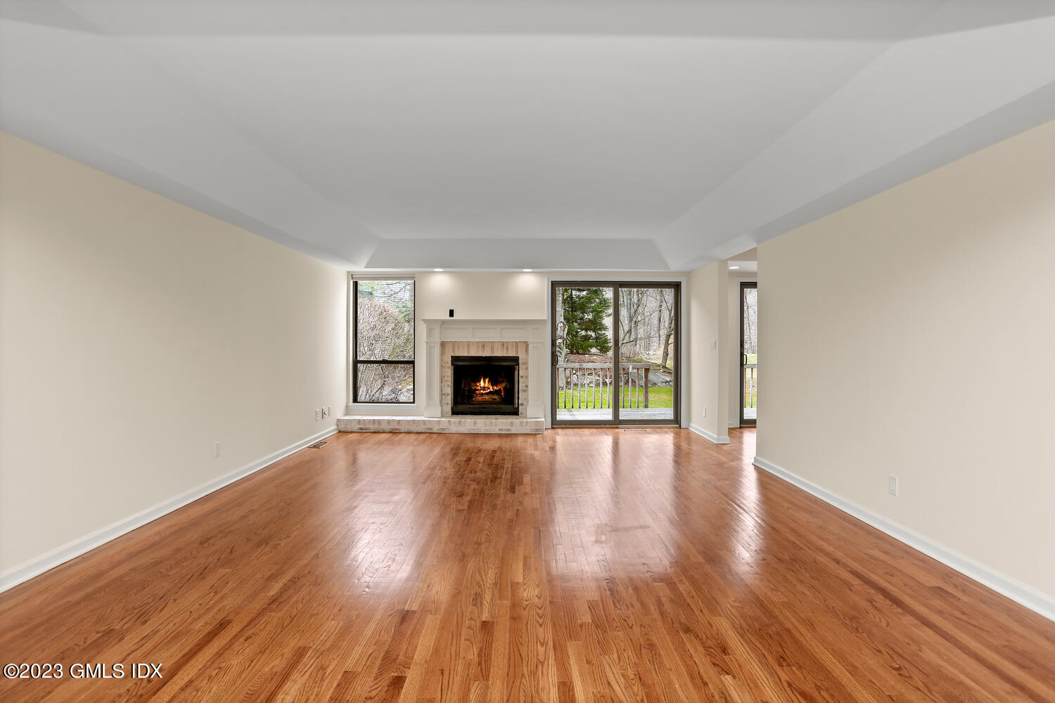 500 River Road, Unit 5 Cos Cob, CT 06807 - Photo 3 of 30 a view of empty room with wooden floor and fireplace