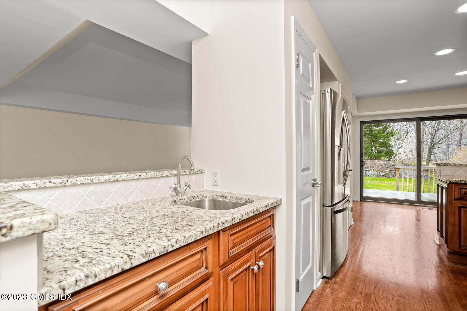 500 River Road, Unit 5 Cos Cob, CT 06807 - Photo 9 of 30 a bathroom with a granite countertop sink and a large mirror