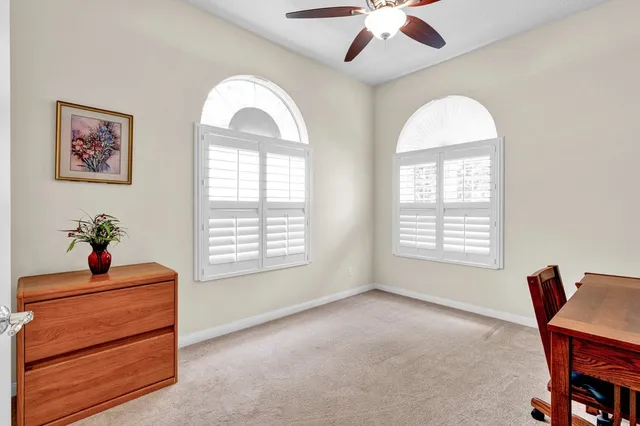 a view of a livingroom with furniture and a chandelier