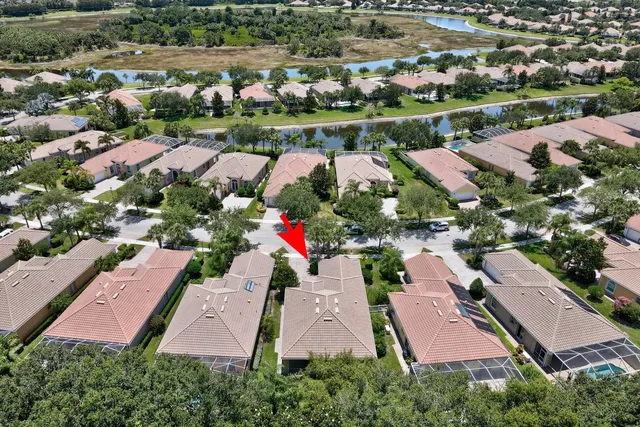 an aerial view of residential house with outdoor space and parking