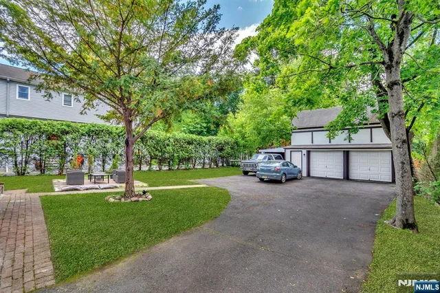 a picture of a room with a white refrigerator and a white refrigerator