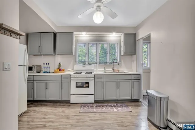 a bedroom with a bed and mirror