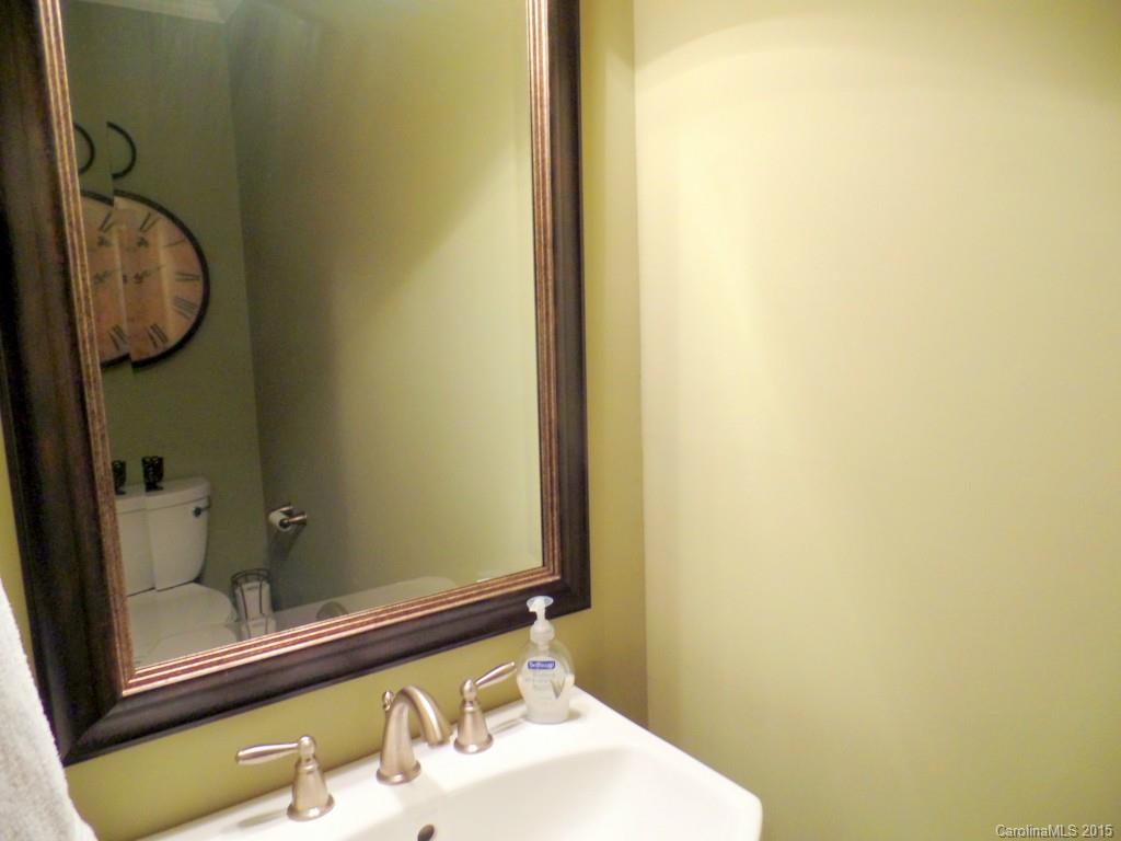 209 Campsite Road Rock Hill, SC 29732 - Photo 8 of 21 a bathroom with a granite countertop sink and a mirror
