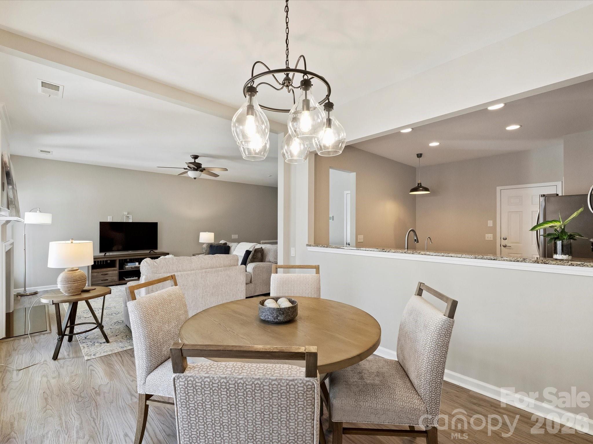 15544 Canmore Street Charlotte, NC 28277 - Photo 20 of 36 a view of a dining room with furniture and wooden floor