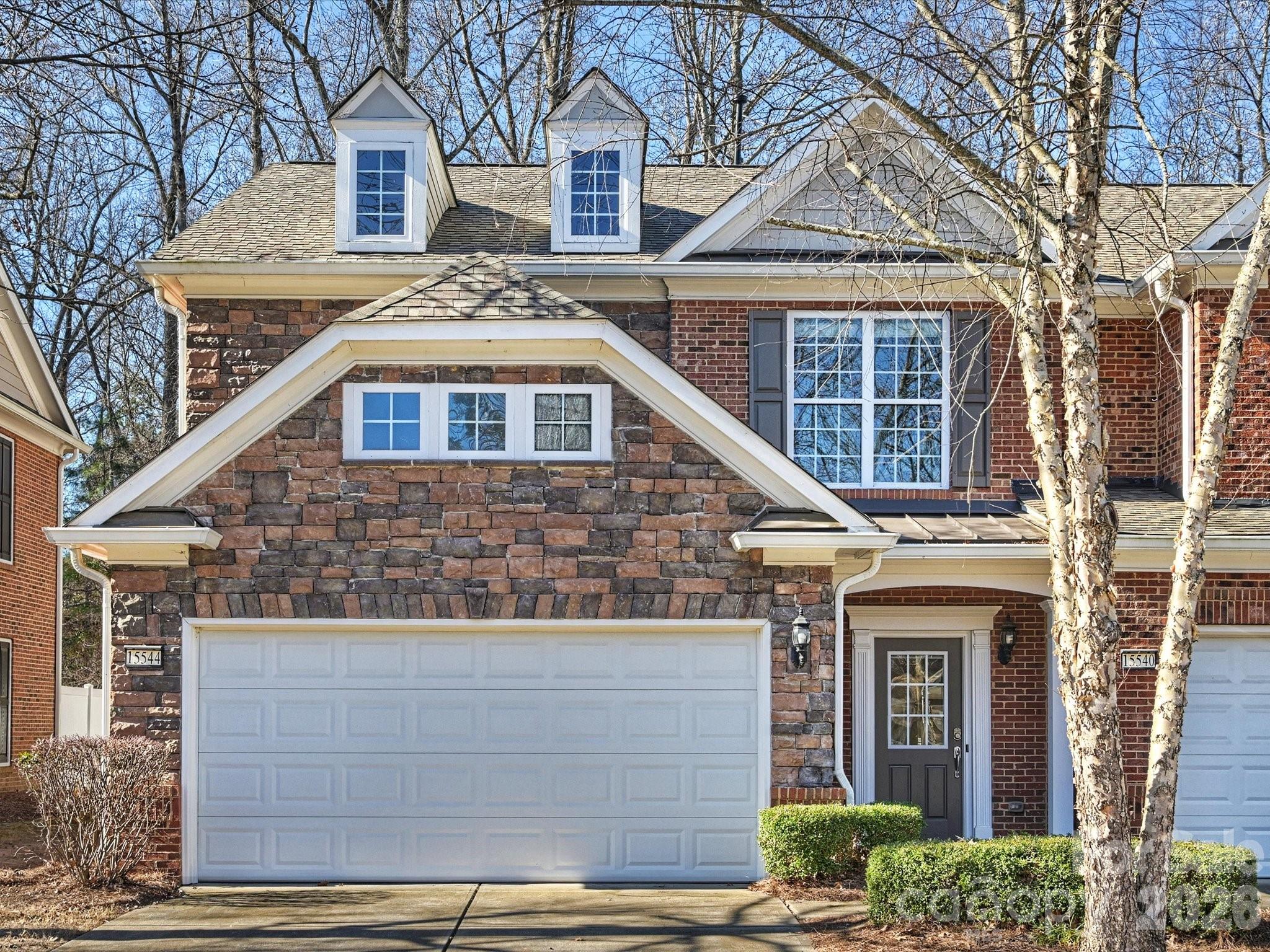 15544 Canmore Street Charlotte, NC 28277 - Photo 2 of 36 a front view of a house with a yard