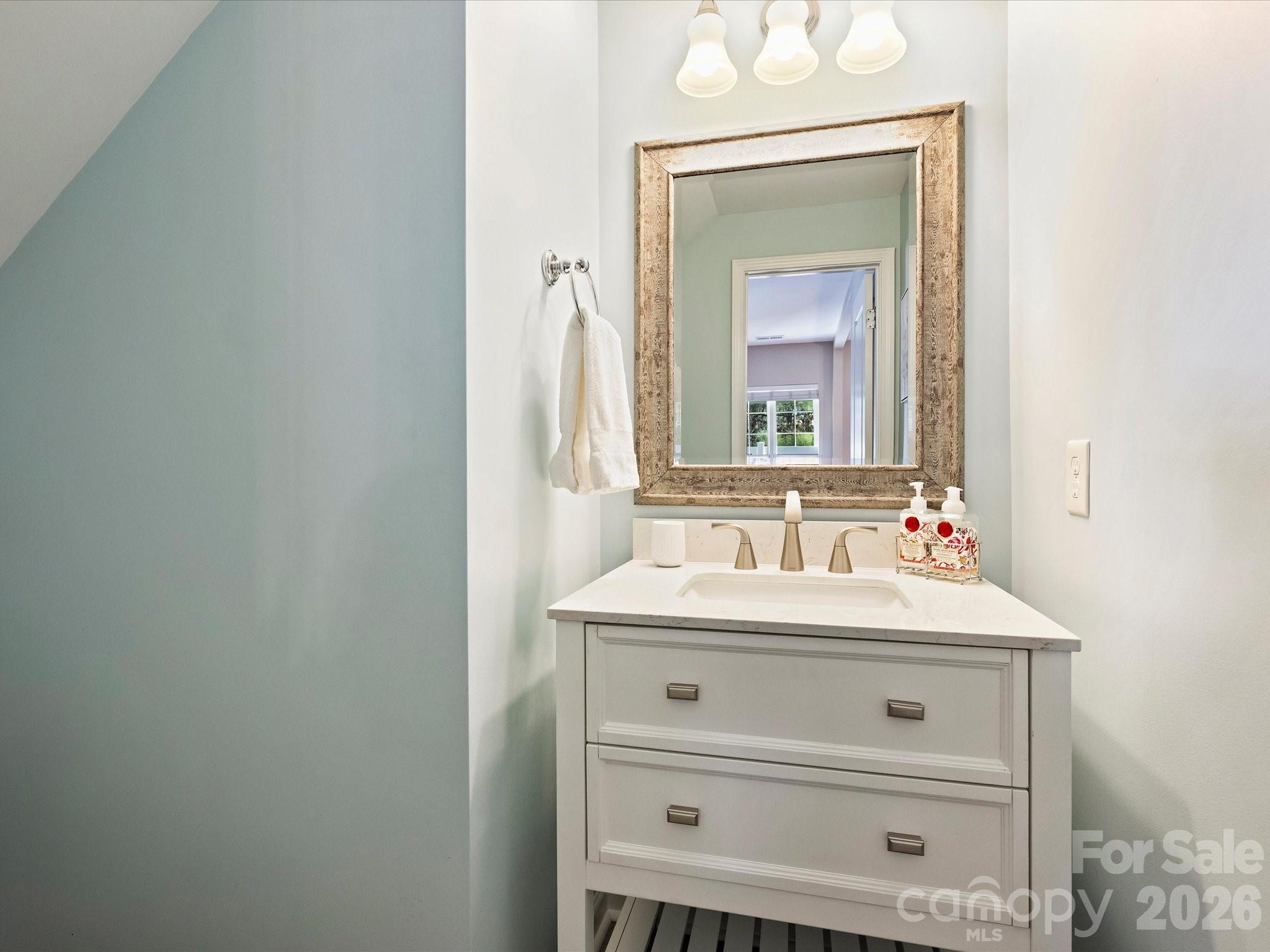 15544 Canmore Street Charlotte, NC 28277 - Photo 21 of 36 a bathroom with a sink vanity and a mirror