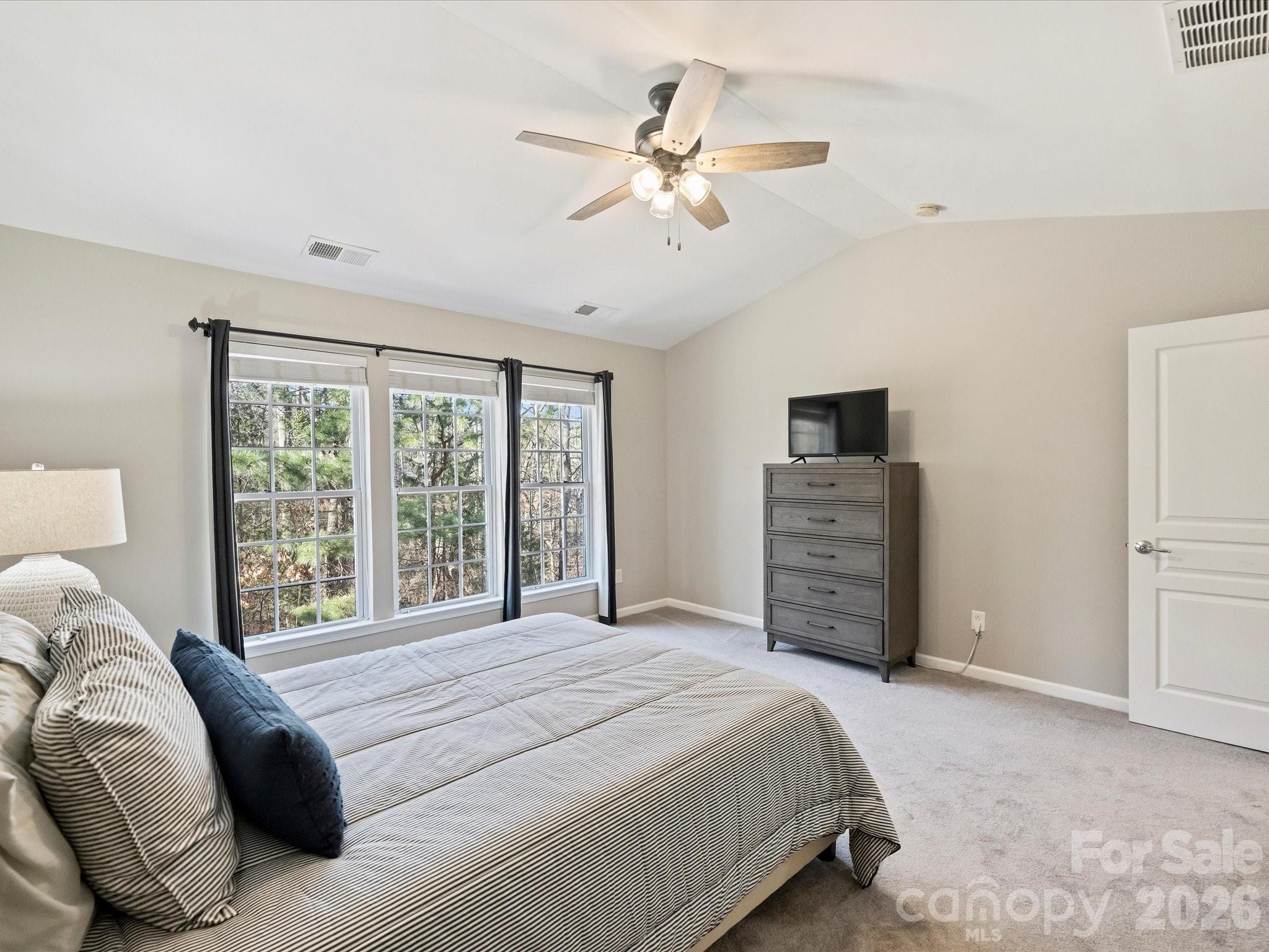15544 Canmore Street Charlotte, NC 28277 - Photo 23 of 36 a bedroom with a bed dresser and a window