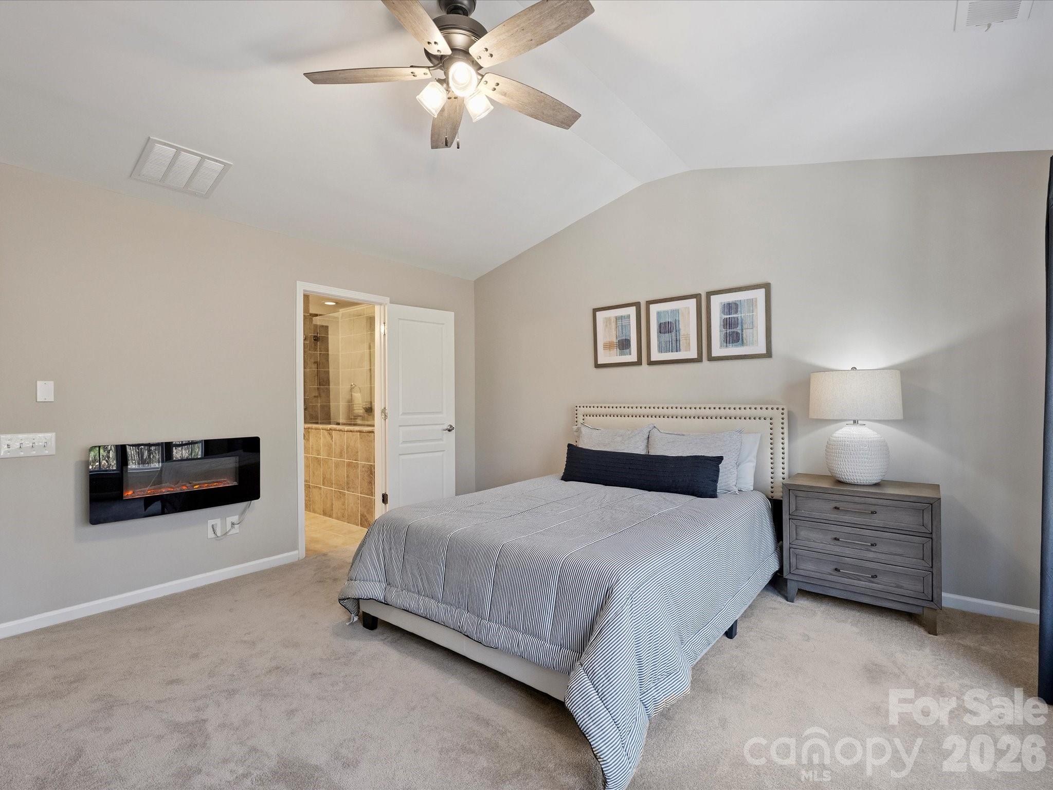15544 Canmore Street Charlotte, NC 28277 - Photo 25 of 36 a bedroom with a bed and a chandelier