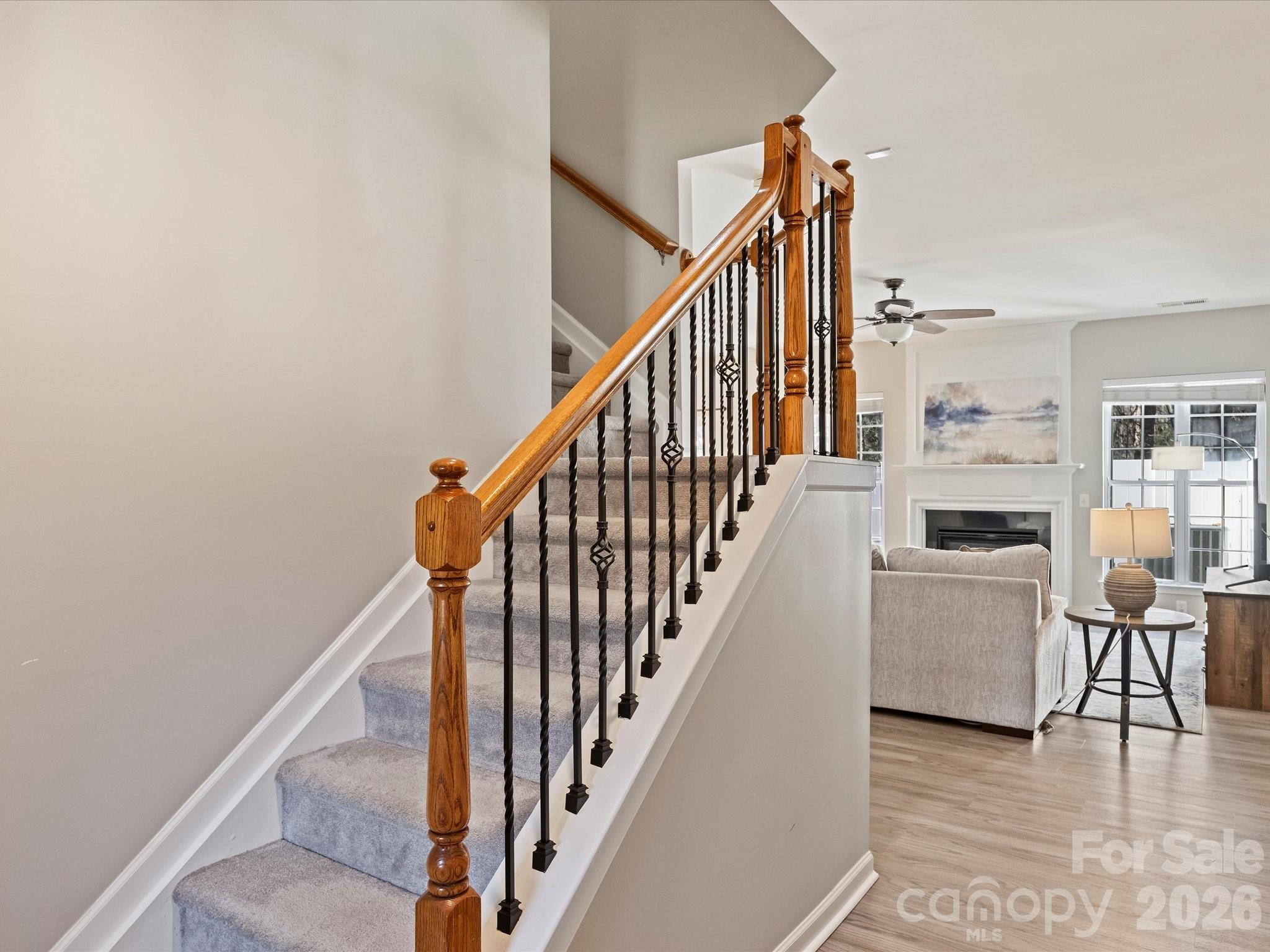 15544 Canmore Street Charlotte, NC 28277 - Photo 5 of 36 a view of a hallway with wooden floor and staircase