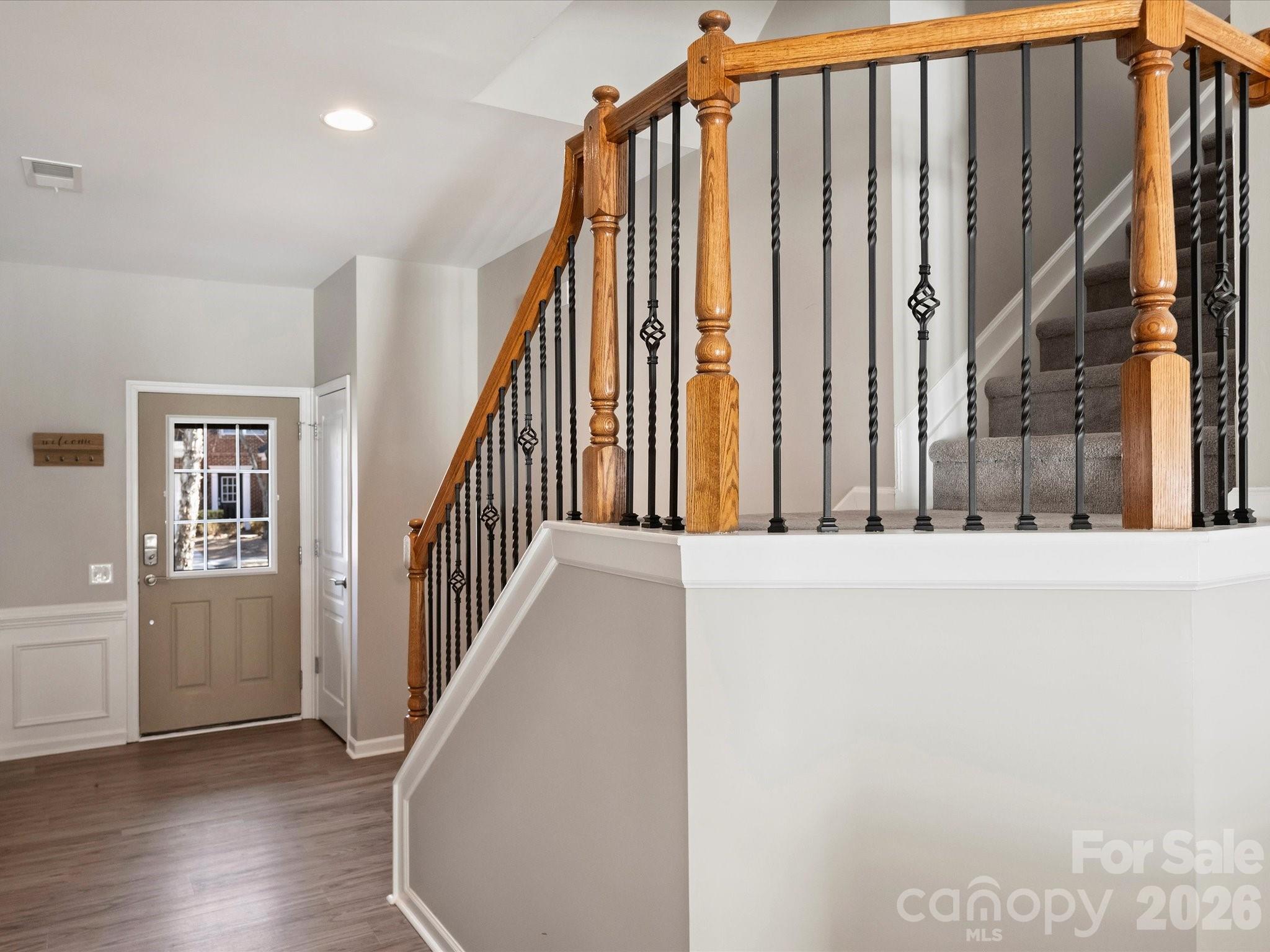 15544 Canmore Street Charlotte, NC 28277 - Photo 6 of 36 a view of staircase with wooden floor and chair