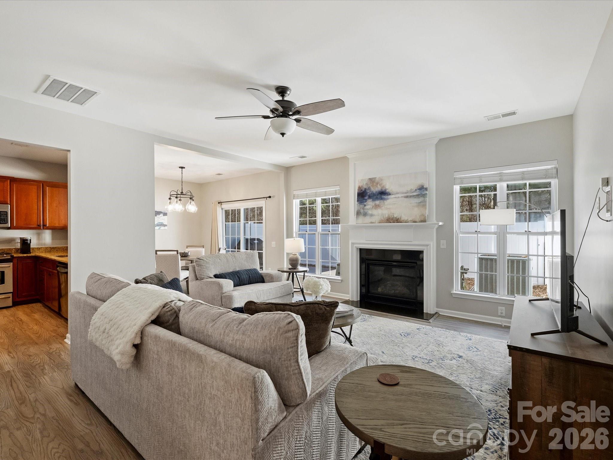 15544 Canmore Street Charlotte, NC 28277 - Photo 7 of 36 a living room with furniture a fireplace and a flat screen tv