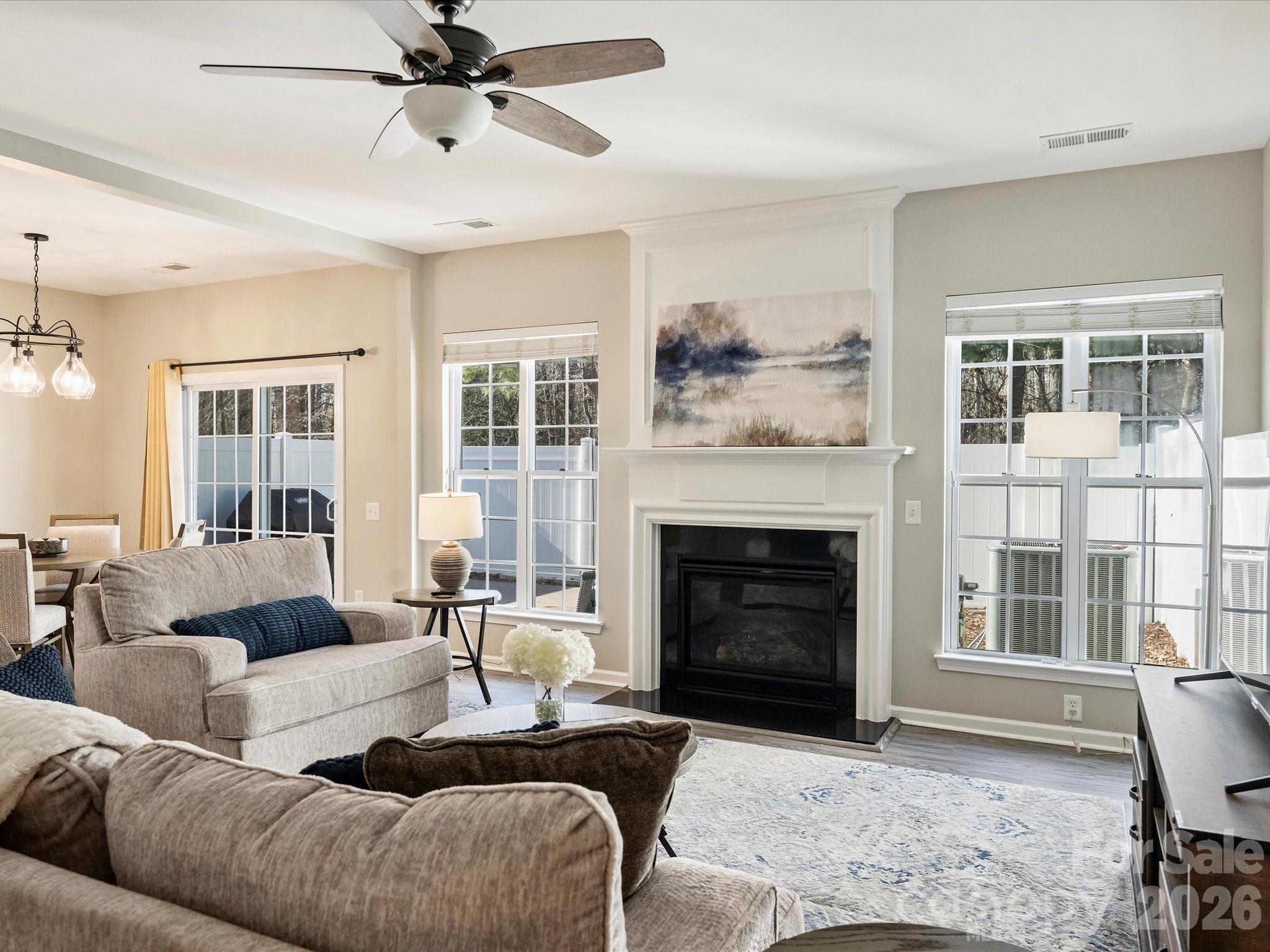 15544 Canmore Street Charlotte, NC 28277 - Photo 8 of 36 a living room with furniture and a fireplace