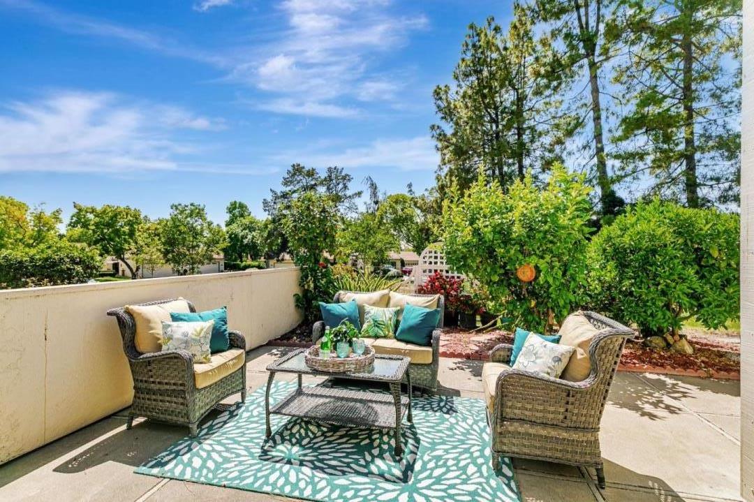 a view of a patio with couches chairs and a table